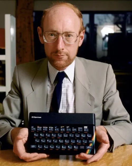 Sir Clive Sinclair holding one of his ZX Spectrum home computers