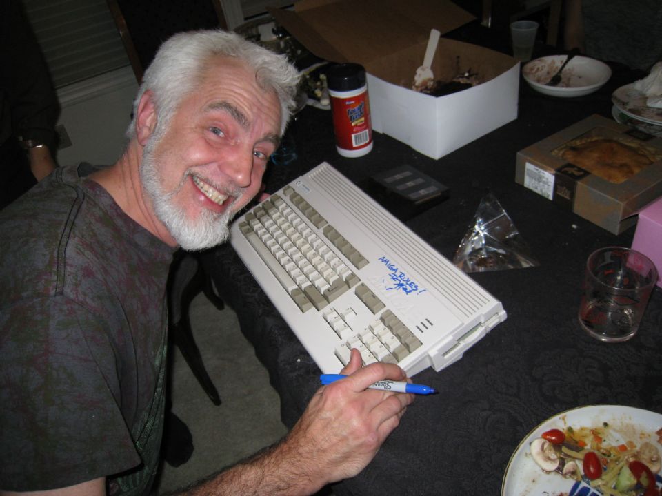 RJ Mical signing an Amiga for the computer's 25th anniversary, 2010. Photo by Patrick M, CC BY-SA 2.0.